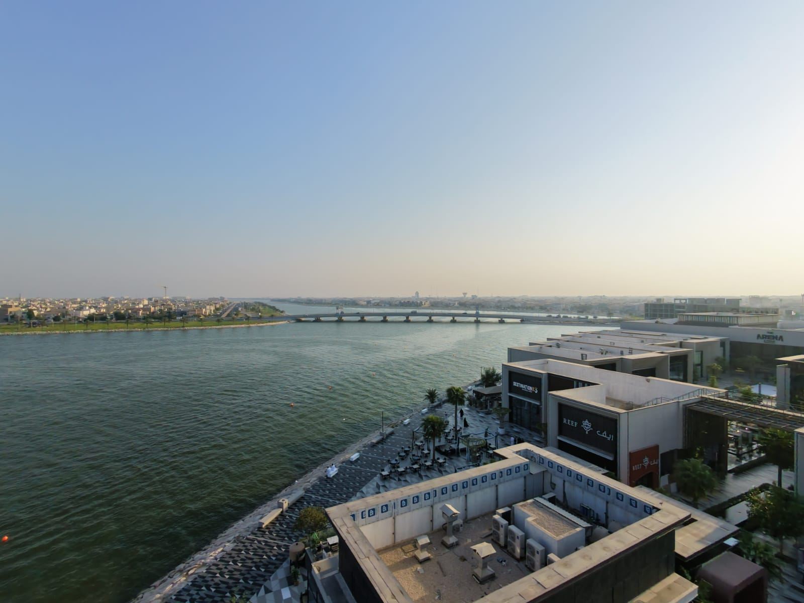 Aerial drone photo of a waterfront promenade and bridge in the Eastern Province, Saudi Arabia
